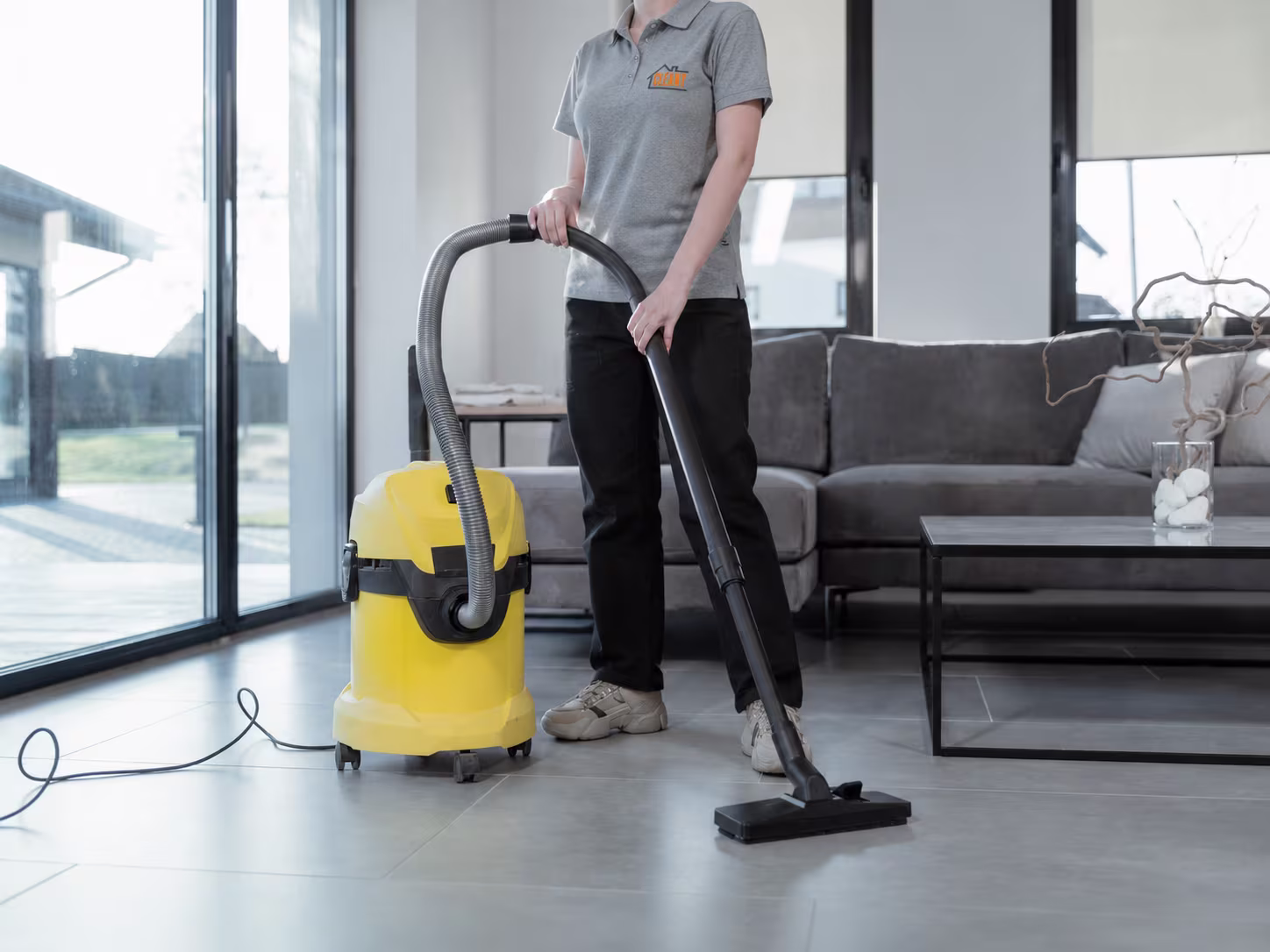 Professional home cleaner working in a Doha apartment — Cleanly Qatar